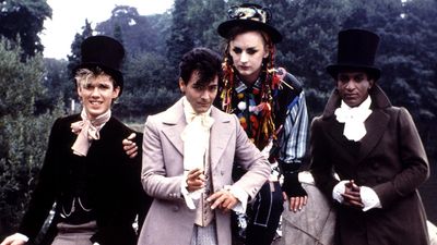 British musical group Culture Club on the set of the "Karma Chameleon" video, 1983; (left to right) Roy Hay, Jon Moss, Boy George and Mikey Craig.