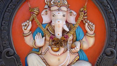 Ganesha. Hinduism. Ganesha, the elephant-headed Hindu god of beginnings, figure on external walls of a South Indian Temple in Kerala, India.