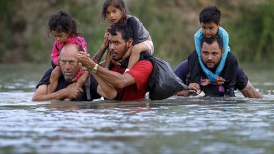 Migrants cross the Rio Grande in Eagle Pass, Texas, the United States on July 25, 2022.  Immigrants immigration border crisis U.S and Mexico river