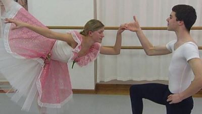 See a ballet teacher instructing the dancers