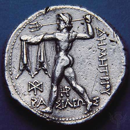 (Top) Obverse side of a silver tetradrachm showing Nike standing on prow of ship; (bottom) Poseidon hurling trident on the reverse side, 306-282 BC. Diameter 28 mm.