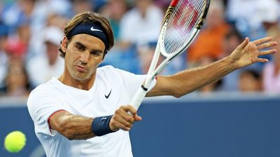 MASON, OH - AUGUST 17: Roger Federer of Switzerland hits a backhand against Mardy Fish during day seven of the Western & Southern Open at Lindner Family Tennis Center on August 17, 2012 in Mason, Ohio
