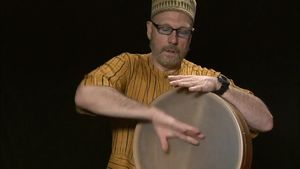 See Tom Teasley playing the frame drum using different drumming styles from various countries