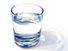 water glass on white background. (drink; clear; clean water; liquid)